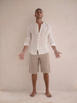 Relaxed men's collarless shirt made from textured Italian raw linen.