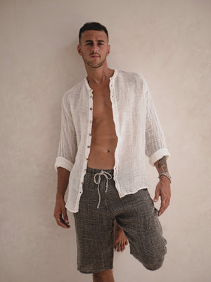 Relaxed Italian linen shorts designed for warm-weather dressing.