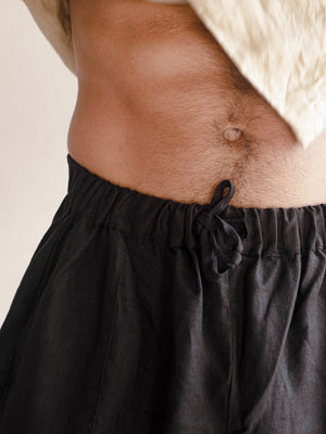 detail of a linen bermuda for men
