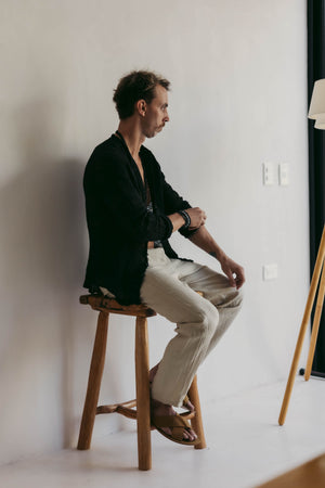 man wearing a Collarless neckline on a handcrafted Italian raw linen shirt.