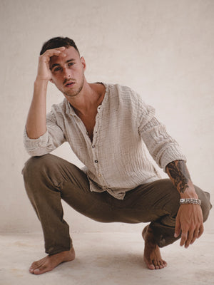Man wearing an Open-weave textured Italian raw linen fabric with a natural crinkled finish.