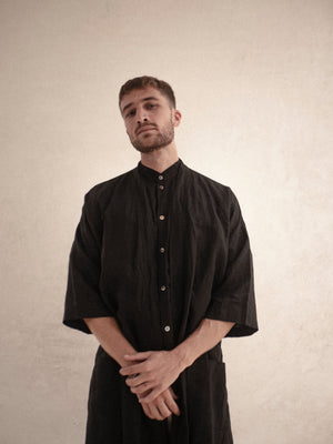 Long black linen kimono with timeless tailoring and oversized fit.