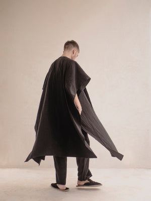 Minimalist men's linen ruana with flowing silhouette.