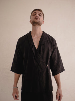 Black men's short linen kimono cover up with relaxed fit and minimalist design.