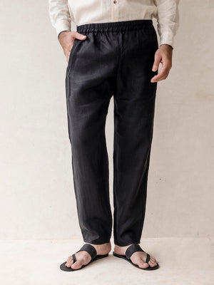 Man wearing the MONACO classic men's linen pants with an elastic waistband.