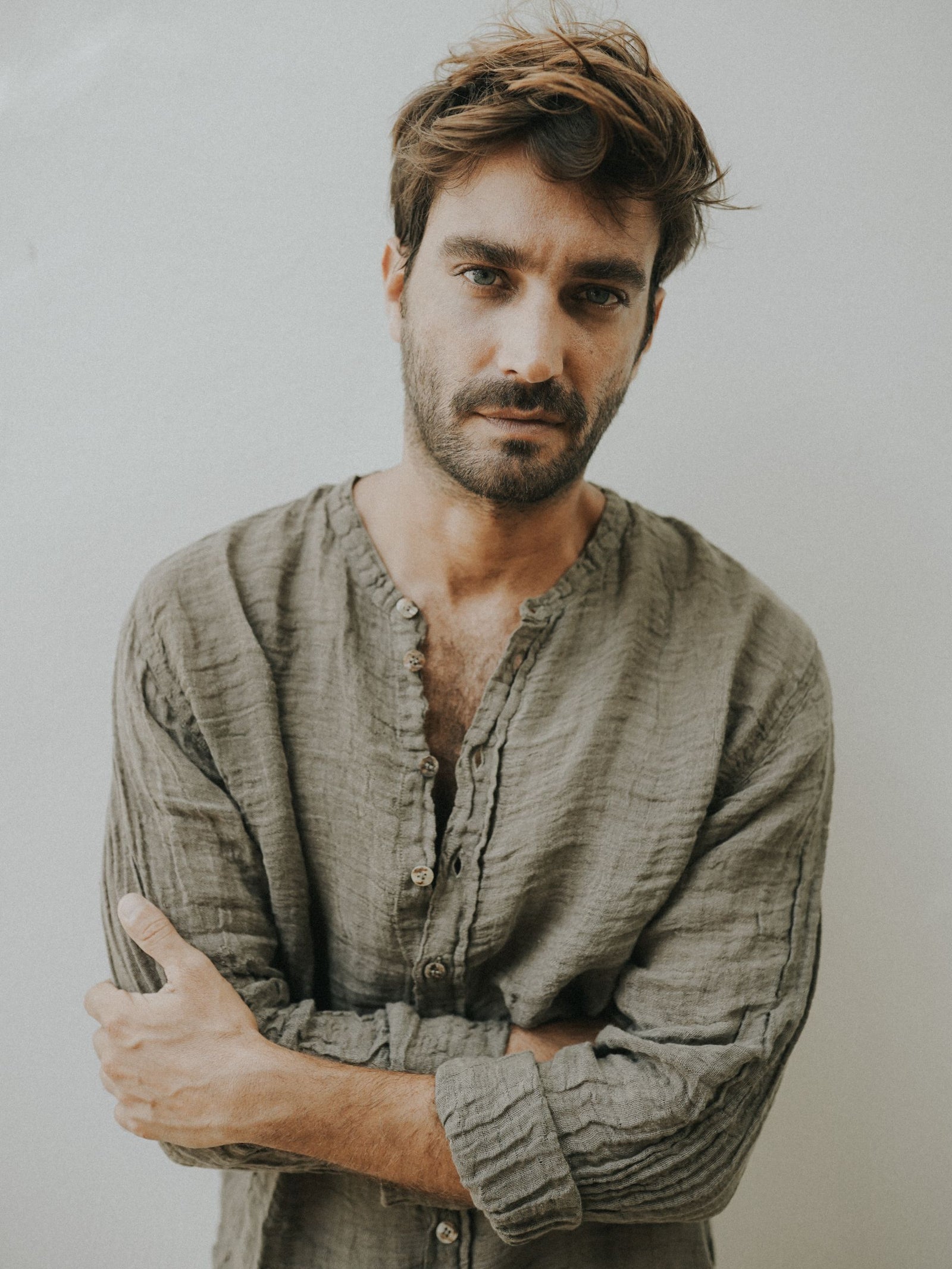 Man wearing the Raw Linen Collarless Shirt crafted from Italian raw linen.